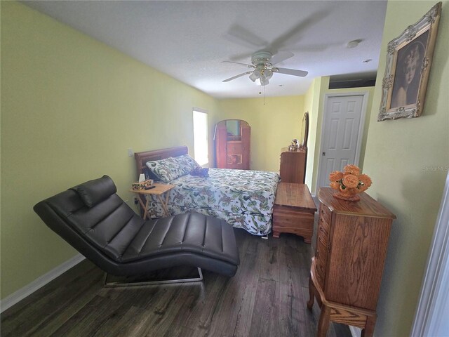 2530 Tamarind Dr, Edgewater, FL 32141 - bedroom with wood finished floors, baseboards, and a ceiling fan