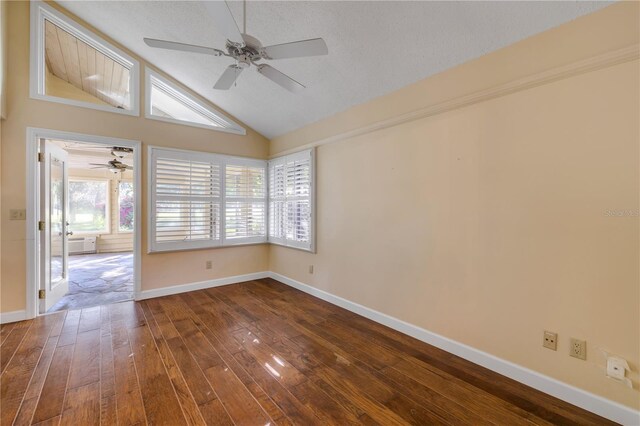 606 Saint Andrews Blvd, New Smyrna Beach, FL 32168 - spare room with ceiling fan, vaulted ceiling, dark wood-style floors, and baseboards