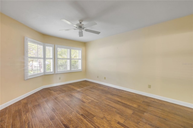 606 Saint Andrews Blvd, New Smyrna Beach, FL 32168 - unfurnished room featuring baseboards, a ceiling fan, and dark wood-style floors