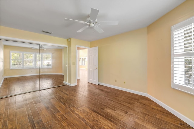 606 Saint Andrews Blvd, New Smyrna Beach, FL 32168 - unfurnished bedroom with a ceiling fan, wood finished floors, a closet, baseboards, and visible vents