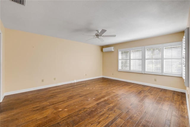 606 Saint Andrews Blvd, New Smyrna Beach, FL 32168 - empty room with a wall mounted air conditioner, a ceiling fan, hardwood / wood-style flooring, baseboards, and visible vents