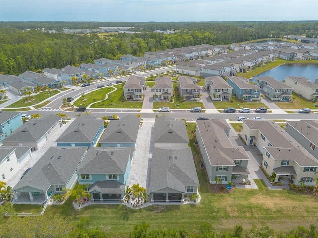 bird's eye view featuring a residential view and a water view