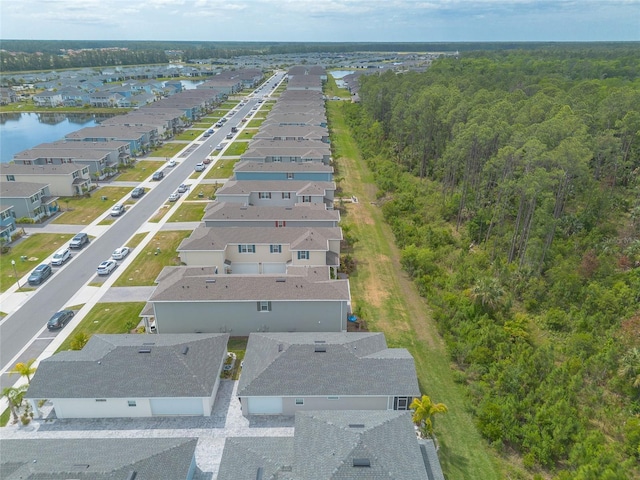 bird's eye view with a residential view and a water view