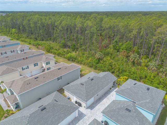 bird's eye view featuring a forest view