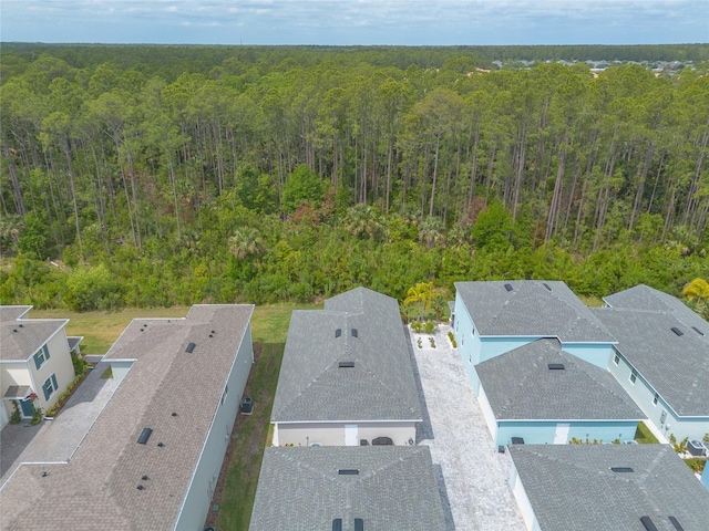 drone / aerial view with a view of trees