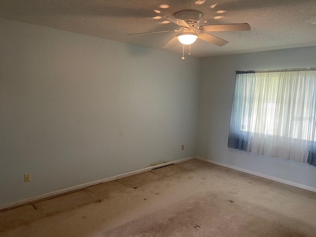 3048 Unity Tree Dr, Edgewater, FL 32141 - spare room featuring a textured ceiling, baseboards, ceiling fan, and carpet