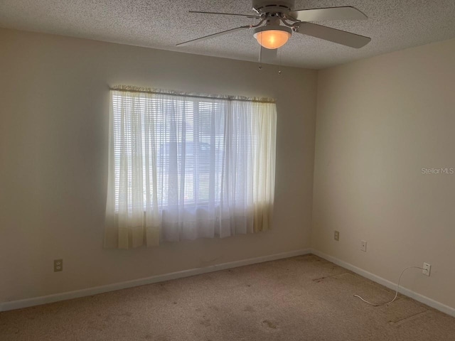 3048 Unity Tree Dr, Edgewater, FL 32141 - carpeted spare room featuring a textured ceiling, baseboards, and ceiling fan