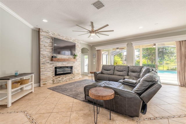 495 Venetian Villa Dr, New Smyrna Beach, FL 32168 - living area with crown molding, ceiling fan, and light tile patterned flooring
