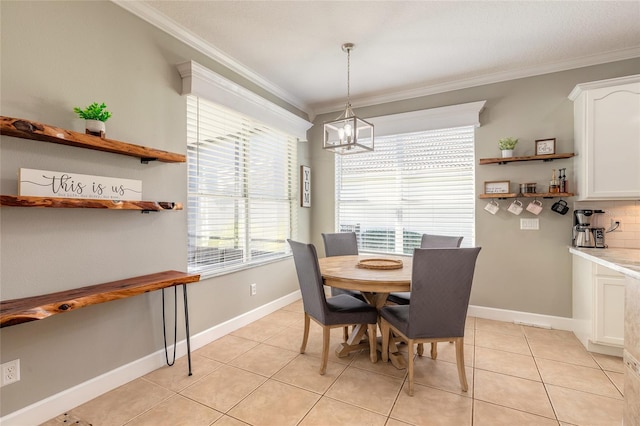 495 Venetian Villa Dr, New Smyrna Beach, FL 32168 - dining space featuring crown molding, an inviting chandelier, baseboards, and light tile patterned floors
