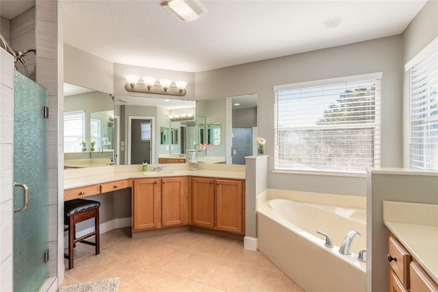 495 Venetian Villa Dr, New Smyrna Beach, FL 32168 - bathroom with tile patterned flooring, a healthy amount of sunlight, a stall shower, and vanity