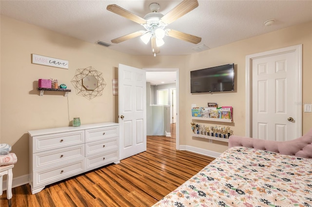 495 Venetian Villa Dr, New Smyrna Beach, FL 32168 - bedroom featuring visible vents, baseboards, ceiling fan, and wood finished floors