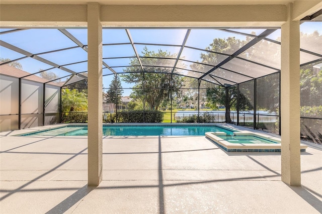 495 Venetian Villa Dr, New Smyrna Beach, FL 32168 - view of swimming pool featuring a patio, a pool with connected hot tub, and glass enclosure
