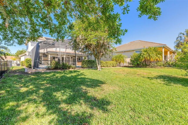495 Venetian Villa Dr, New Smyrna Beach, FL 32168 - view of yard featuring fence and glass enclosure