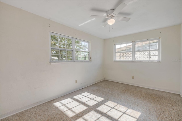 915 E 2nd Ave, New Smyrna Beach, FL 32169 - empty room featuring ceiling fan, light colored carpet, and baseboards
