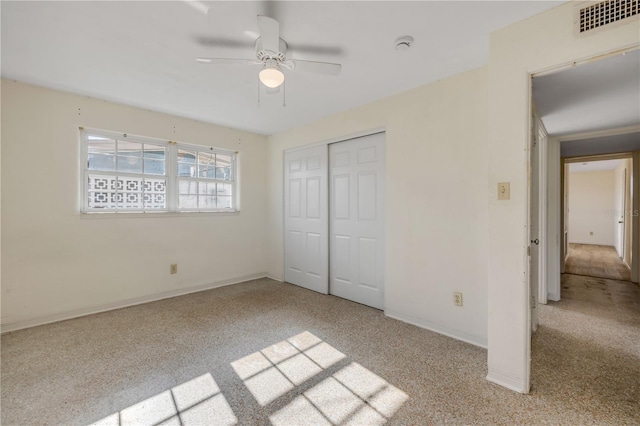 915 E 2nd Ave, New Smyrna Beach, FL 32169 - unfurnished bedroom with visible vents, baseboards, a closet, and carpet