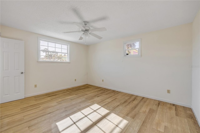 915 E 2nd Ave, New Smyrna Beach, FL 32169 - unfurnished room with light wood-type flooring, a ceiling fan, and baseboards