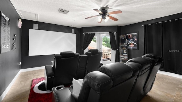 cinema featuring baseboards, ceiling fan, a textured ceiling, and visible vents
