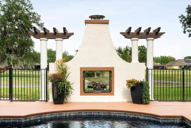 exterior space featuring stucco siding, fence, and a pool