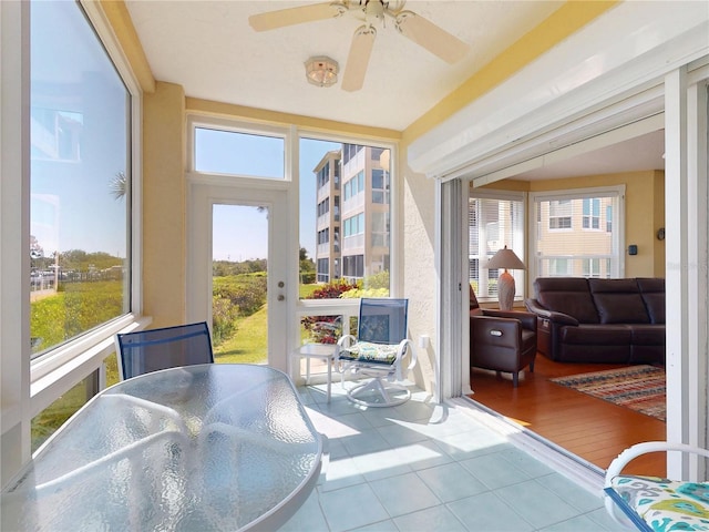 sunroom / solarium with tile patterned flooring