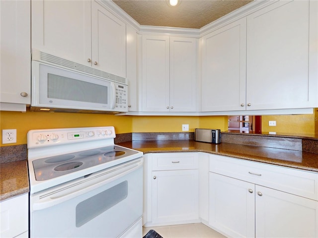 kitchen with white cabinets and white appliances