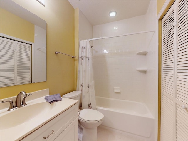 bathroom with tile patterned floors, shower / bathtub combination with curtain, toilet, vanity, and a closet