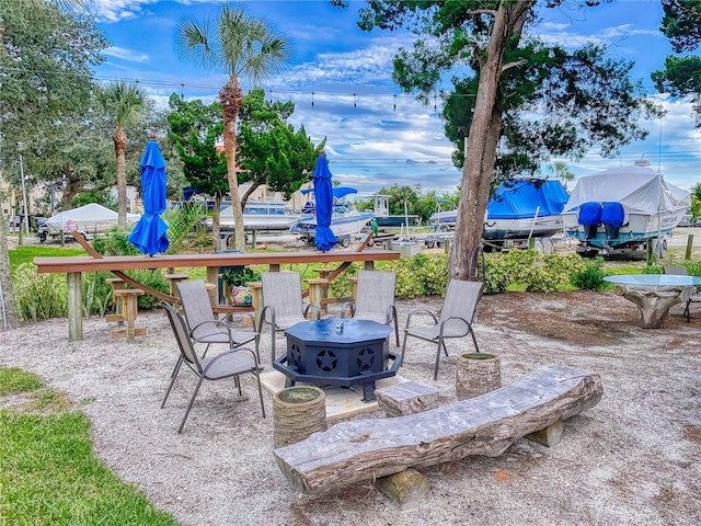 view of patio featuring an outdoor fire pit