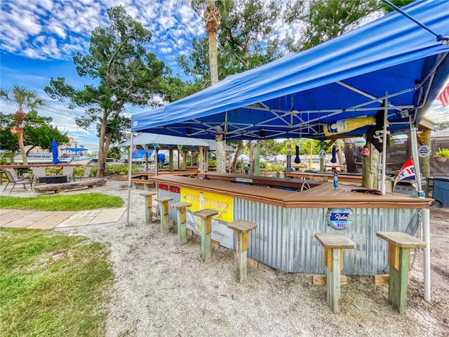 exterior space featuring a gazebo and outdoor dry bar