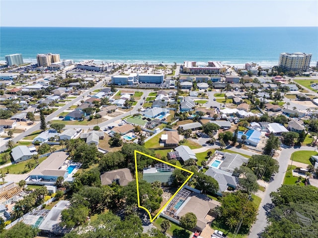drone / aerial view with a water view and a residential view