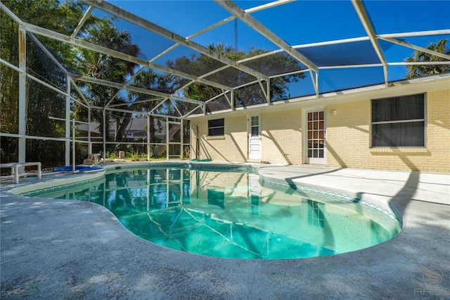 outdoor pool featuring a lanai and a patio
