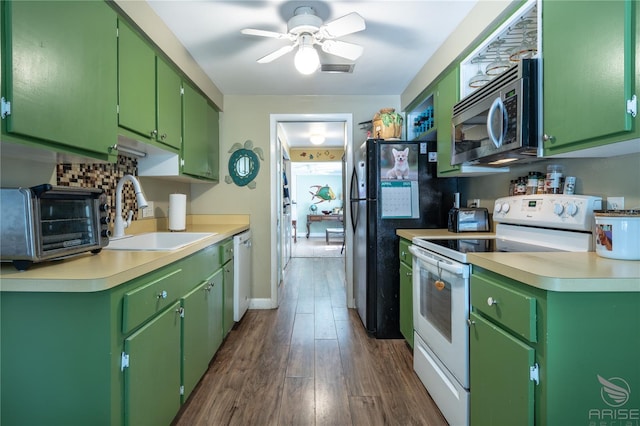 kitchen with light countertops, white appliances, a sink, and a toaster