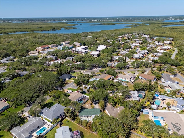 aerial view with a residential view and a water view