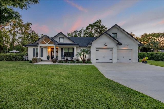 170 Live Oak Ct, New Smyrna Beach, FL 32168 - modern farmhouse style home with a porch, a garage, a front lawn, and concrete driveway