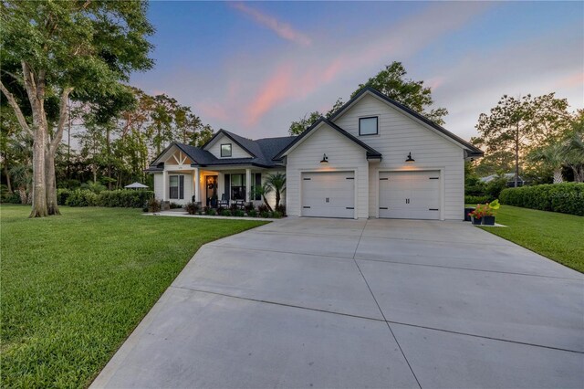 170 Live Oak Ct, New Smyrna Beach, FL 32168 - modern farmhouse style home with a yard, a porch, and driveway