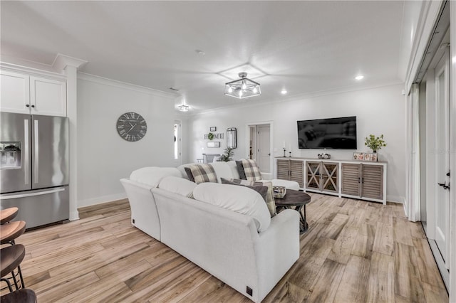 170 Live Oak Ct, New Smyrna Beach, FL 32168 - living area featuring baseboards, recessed lighting, light wood-type flooring, and crown molding