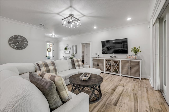 170 Live Oak Ct, New Smyrna Beach, FL 32168 - living area featuring light wood-style flooring, ornamental molding, visible vents, recessed lighting, and baseboards