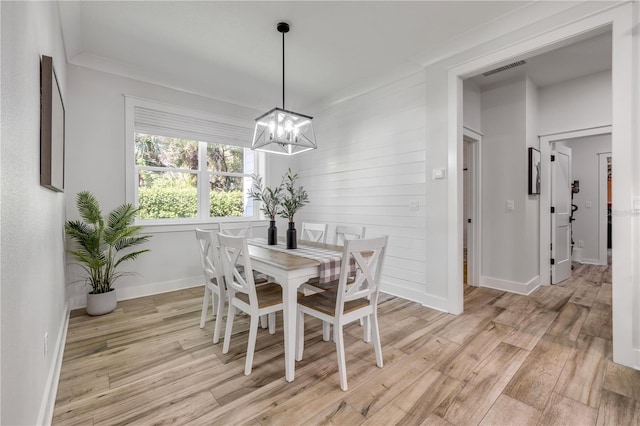 170 Live Oak Ct, New Smyrna Beach, FL 32168 - dining space featuring visible vents, baseboards, a chandelier, and light wood-style floors
