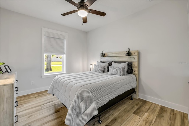 170 Live Oak Ct, New Smyrna Beach, FL 32168 - bedroom featuring baseboards, a ceiling fan, and wood finished floors