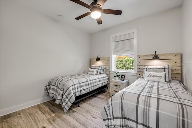 170 Live Oak Ct, New Smyrna Beach, FL 32168 - bedroom with light wood-style floors, ceiling fan, and baseboards