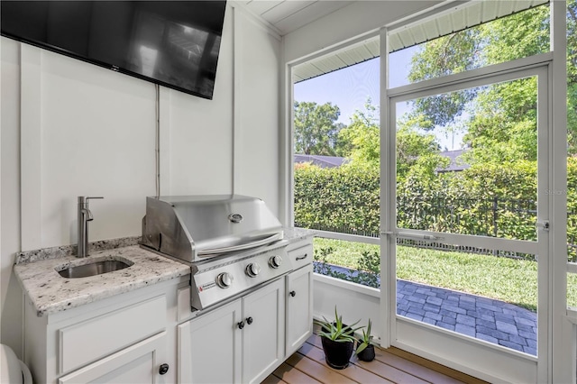 170 Live Oak Ct, New Smyrna Beach, FL 32168 - interior space featuring a sink, plenty of natural light, and wood finished floors