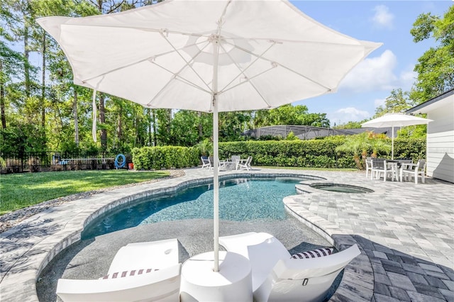 170 Live Oak Ct, New Smyrna Beach, FL 32168 - view of swimming pool featuring a patio, an in ground hot tub, and fence