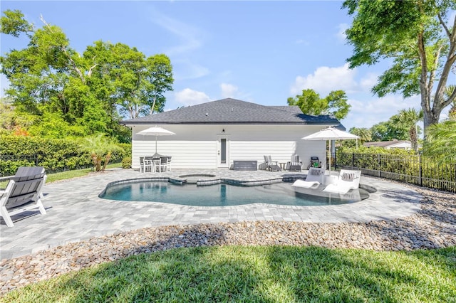 170 Live Oak Ct, New Smyrna Beach, FL 32168 - view of swimming pool featuring a patio, fence, and an in ground hot tub