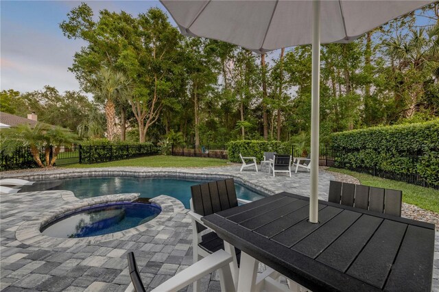 170 Live Oak Ct, New Smyrna Beach, FL 32168 - view of pool with a patio, an in ground hot tub, a fenced backyard, and outdoor dining area