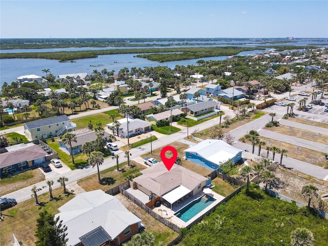 aerial view with a residential view and a water view