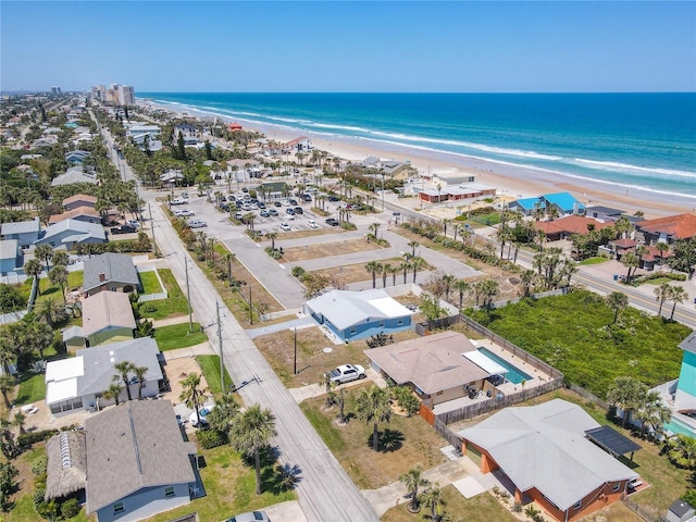 aerial view featuring a water view and a view of the beach