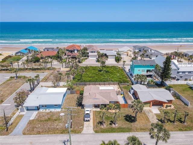 birds eye view of property featuring a water view and a view of the beach