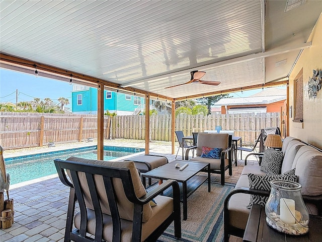 view of patio / terrace featuring a fenced in pool, an outdoor living space, a ceiling fan, outdoor dining area, and a fenced backyard