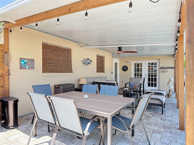 view of patio / terrace with french doors, an outdoor living space, a ceiling fan, and outdoor dining area