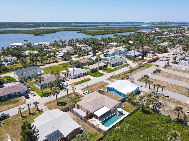 birds eye view of property featuring a water view and a residential view