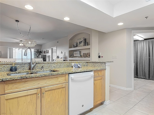 kitchen featuring dishwasher, light brown cabinets, light tile patterned floors, a sink, and light stone countertops