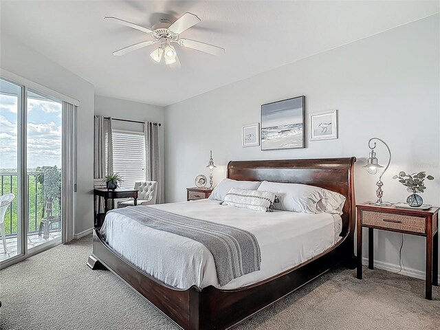 bedroom featuring multiple windows, carpet flooring, and access to exterior